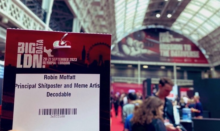 Conference badge that reads &ldquo;Robin Moffatt: Principal Shitposter and Meme Artist&rdquo;